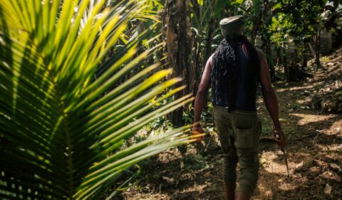 Rastaman working with his Workerwear Rasta Cap Dreadlock Hat Rastafari Crown