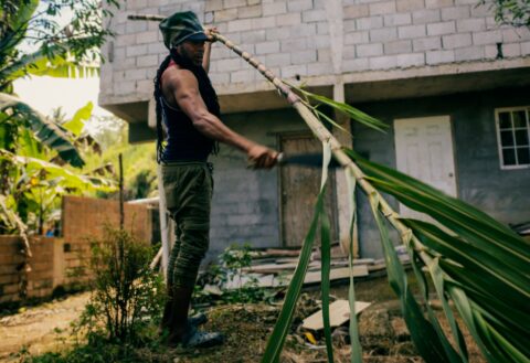 Rastaman working with his Workerwear Rasta Cap Dreadlock Hat Rastafari Crown